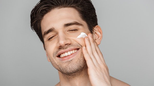Men Applying Vitamin C serum