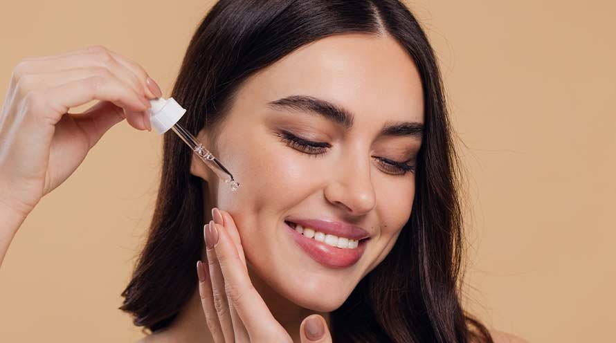 Women Applying Serum