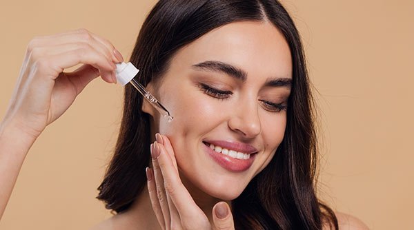 Women Applying Serum