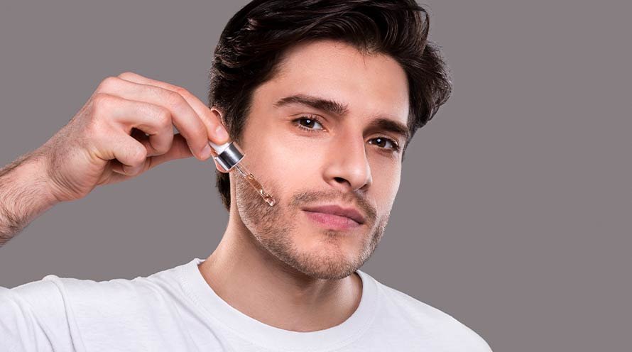men applying serum